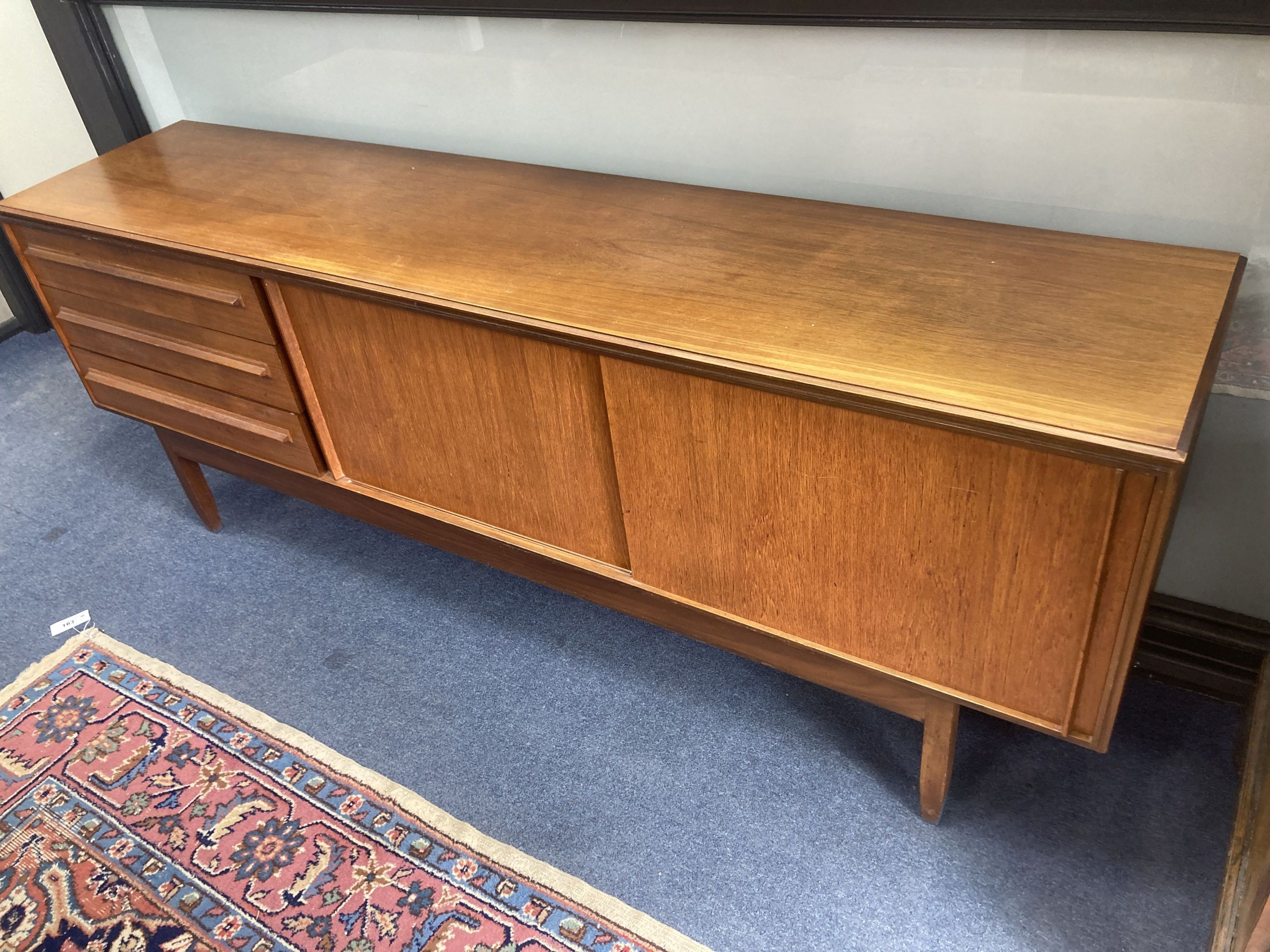 A White and Newton teak dining table, length 168cm extended, width 84cm, height 72cm together with four dining chairs height 71 cm. and